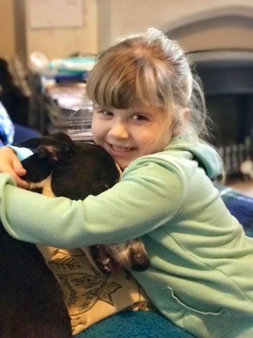 Here is Notspot on the settee getting a cuddle from his favourite little person.